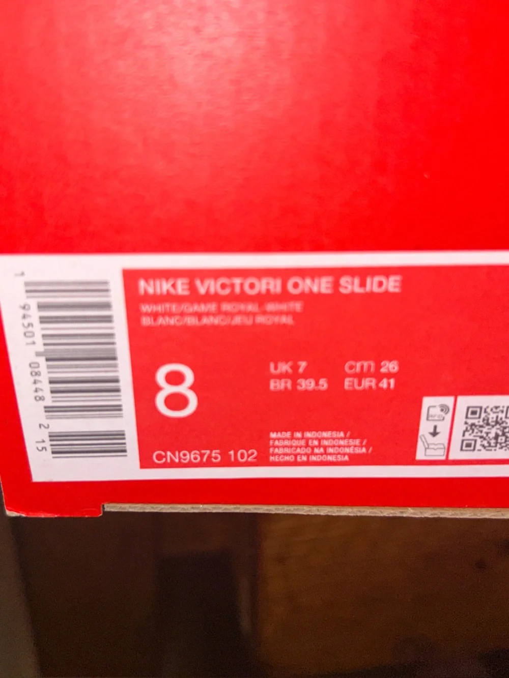 Nike White Slide Sandals with Blue Swoosh